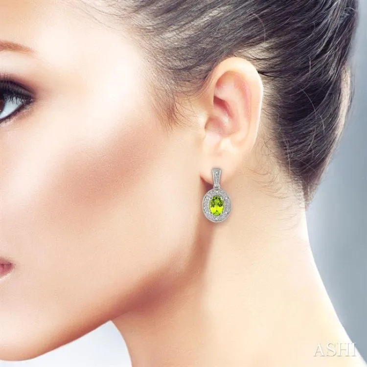 7x5 MM Oval Cut Peridot and 1/20 Ctw Single Cut Diamond Earrings in Sterling Silver